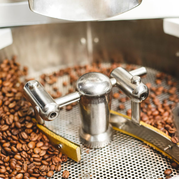 fresh-roasted-coffee-beans-in-a-modern-coffee-roas-RX5MYDF
